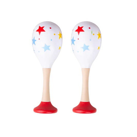 The Bigjigs Junior Maracas Red feature two wooden maracas with white tops, adorned with red, blue, and yellow stars and dots. Perfectly crafted as an enchanting music toy for toddlers, the handles are a light beige that seamlessly transitions into red at the base. These maracas stand upright against a white background.