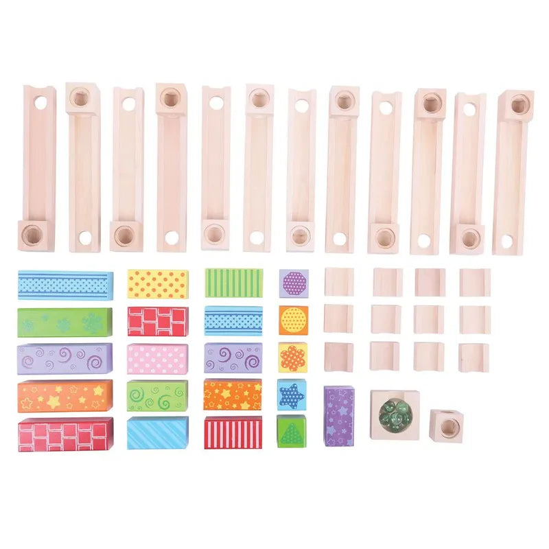 The Bigjigs Marble Run offers a mix of wooden rectangular pieces and colorful patterned blocks, featuring stripes and polka dots, ideal for imaginative play. This educational toy is both fun and visually stimulating, engaging young minds with various shapes and sizes.