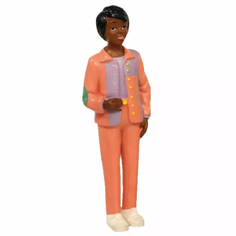 A pink-suited puppet representing the Miniland Figures African Family for kids' puppet shows.
