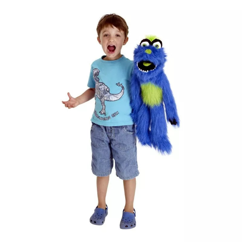 A young boy is holding a puppet.