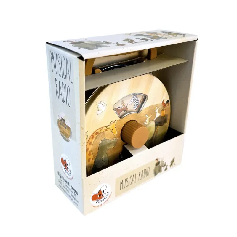 The Musical Radio Noah's Ark is a boxed wooden toy radio with a large tuning knob, handle, and animal illustrations (giraffe, zebra, elephant), packaged in white with playful animal graphics and "Musical Radio" text.