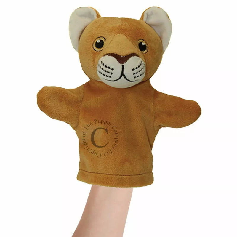 A hand holding The Puppet Company My First Puppet Lion.