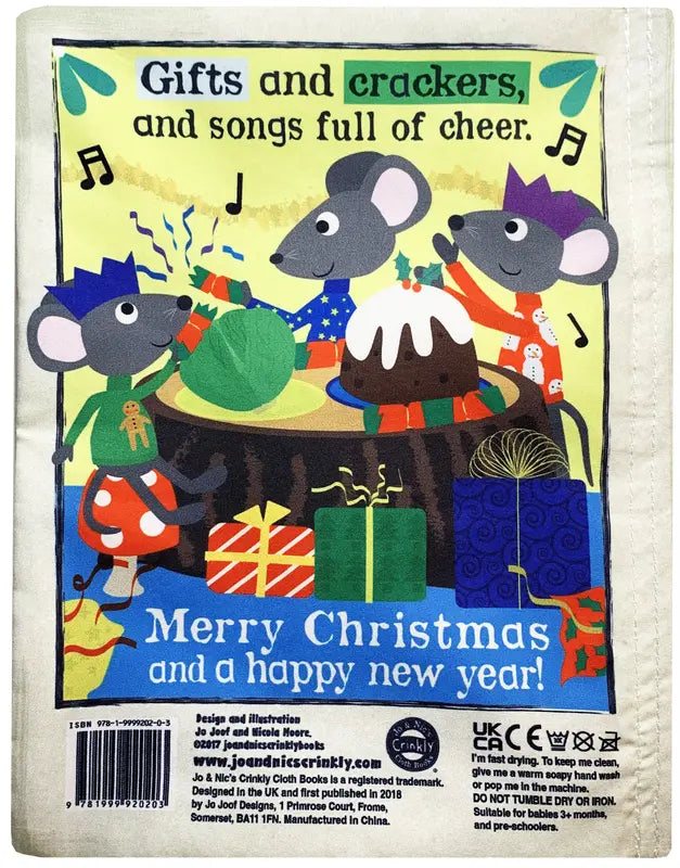 The Crinkly Cloth Book Christmas Mice features three festive mice with hats around a table of pudding, gifts, and crackers, plus the message: “Gifts and crackers…Merry Christmas and a happy new year!”—a charming baby gift.