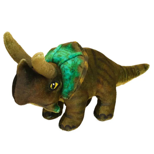 The Natural History Museum Small Triceratops Soft Toy is a green and brown plush dinosaur, with three horns, a frilled neck, yellow eyes, and stands on four legs.
