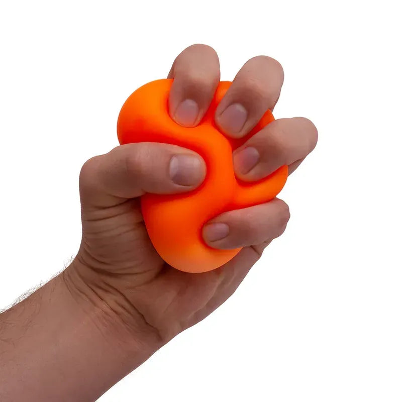 A hand squeezes a Classic Needoh, a vibrant orange fidget toy crafted from non-toxic material, against a plain white background.