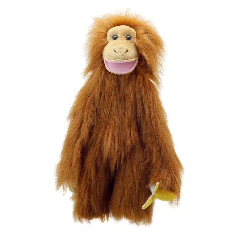 The Puppet Company Medium Puppet Primate Orangutan entertains kids during a puppet show, holding a banana.