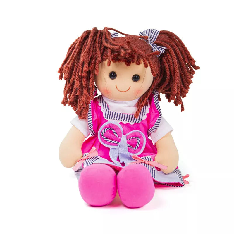 A Bigjigs Emma Doll Large sitting on the ground.