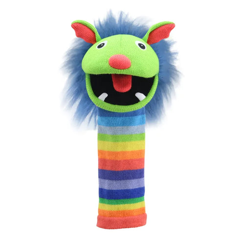 Introducing The Puppet Company Sockette Puppet Rainbow: A vibrant and playful puppet featuring a green head with large round eyes and a wide-open red mouth. This charming character boasts blue fuzzy hair, prominent orange ears, and a rainbow-colored striped body.