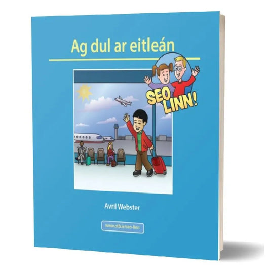 A book titled "Seo linn! – Scéalta Sóisialta Ag dul ar eitleán" by Avril Webster features a blue cover with an illustration of a smiling boy holding a red suitcase in an airport. In the background, people are seated and an airplane is taking off. This children's book includes a "Seo Linn!" badge with two cartoon figures, aimed at promoting confidence building and language development.