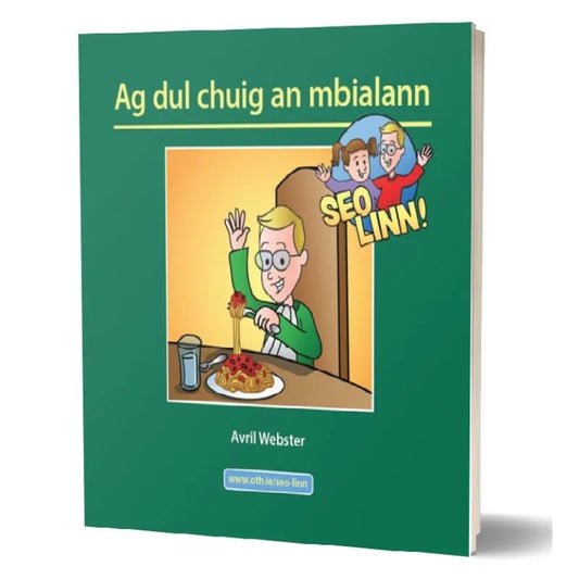Cover of the children's book "Seo linn! – Scéalta Sóisialta Ag dul chuig an mbialann" by Avril Webster. The cover is green with an illustration of a person in glasses expressing excitement while sitting at a table with a plate of spaghetti. Text "SEO LINN!" with animated characters is at the top-right, promoting language development and self-esteem.