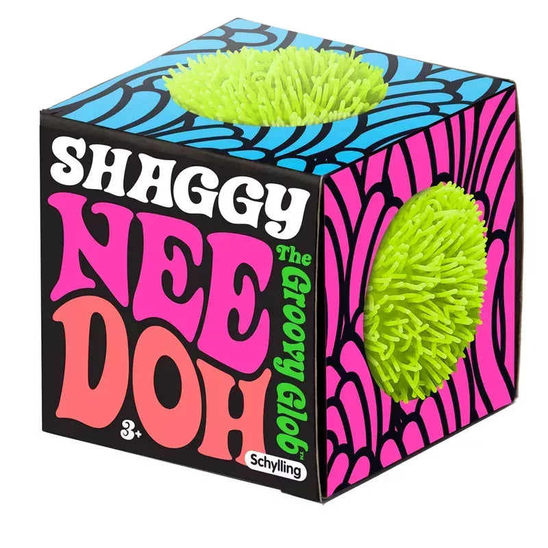 A vibrant, psychedelic-patterned box for a Shaggy NeeDoh Stress Ball, featuring two textured, green anxiety relievers resting on its surface.