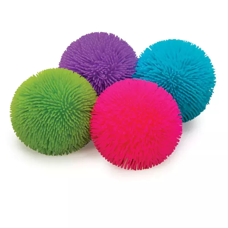 A collection of vibrant, spiky Shaggy NeeDoh Stress Balls in various colors, including green, purple, blue, and pink, clustered together on a white background.