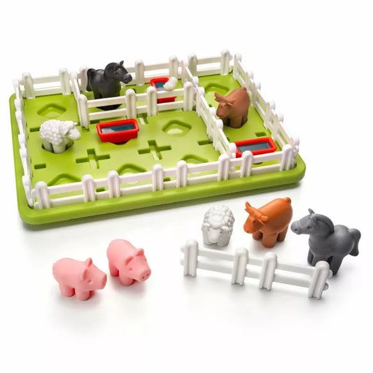 The SmartGames Smart Farmer is a children's farm-themed puzzle game with plastic sheep, pigs, cows, and horses. Within the fenced green play area, two pigs and a sheep are outside. It’s brainteasing fun that encourages problem-solving and comes with extra fences for added challenge.