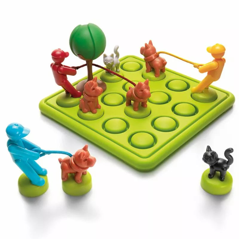 Introducing the SmartGames Walk The Dog, a logic and deduction game that features vibrant plastic figures of people with dogs on leashes, all set on a green board. It includes separate spots for a tree and cat figure, making it an ideal problem-solving toy for strategic thinkers.