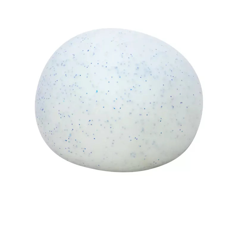 A single speckled white egg isolated on a white background. The egg is dotted with tiny blue and black specks, resembling a Snow Ball Crunch Needoh fidget toy for stress relief.