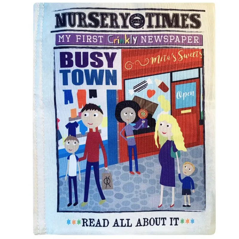 The illustrated cover of "Crinkly Cloth Book Busy Town," a sensory baby book, features diverse cartoon kids and adults standing in front of a shop called "Mia's Sweets.