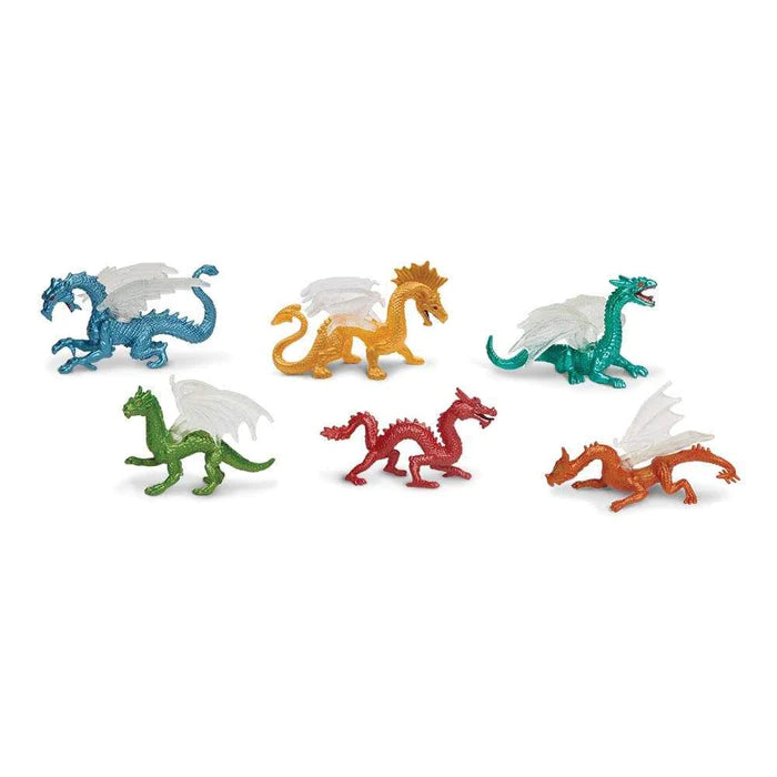 A set of puppet show figurines featuring dragons on a white background.