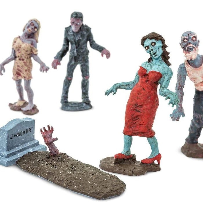 A group of TOOB® Figurines Zombies standing in a puppet show graveyard.