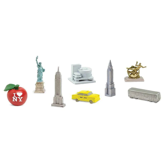 A collection of TOOBS® puppet figurines, including a Statue of Liberty and a bus, perfect for kids.