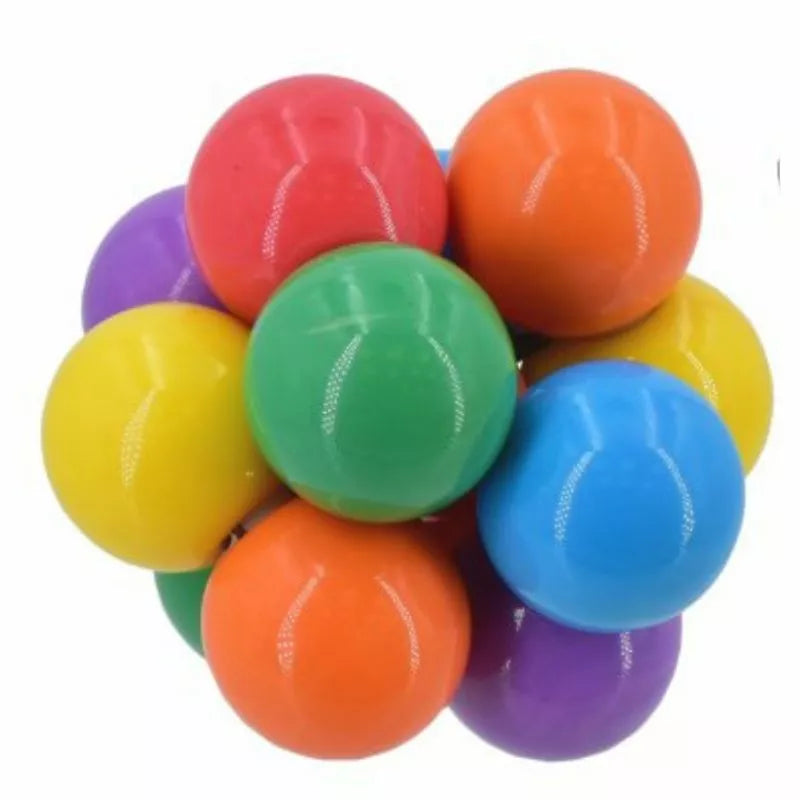 Sentence with product name: A cluster of interlocking colorful Twist and Turn Fidget Balls in red, orange, yellow, green, blue, and purple, arranged tightly together against a white background.