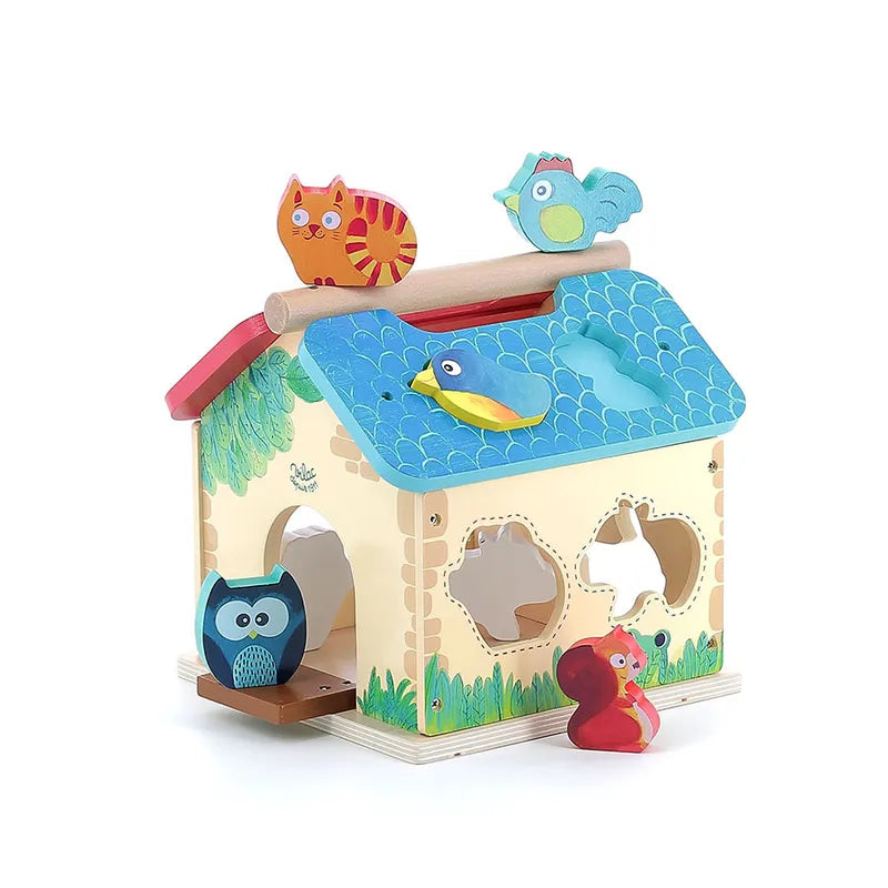 Introducing the Vilac Farm With Shapes, a vibrant wooden toy designed for children aged 2 years and up. This charming toy farm features an eye-catching red roof edge, a blue roof section adorned with fish-scale designs, and beautifully painted green details. The set includes adorable animal figures such as an owl, cat, bird, duck, rabbit, and squirrel—some of which fit perfectly into designated shape slots.