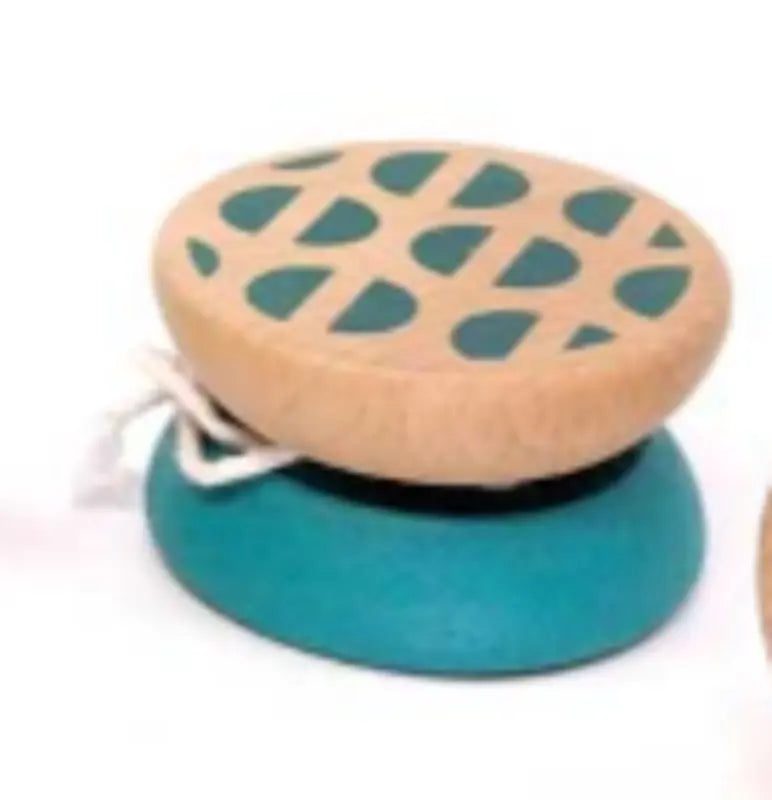 The Wooden Yo-Yo Blue features a beechwood body with a blue bottom, natural wood top, teal geometric designs, and comes pre-strung with white—ideal for screen-free fun.