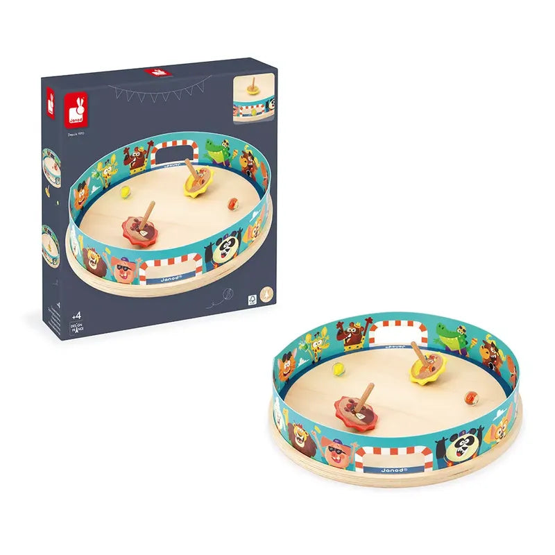 Image of a circular wooden tabletop game with a circus theme. This charming children's toy features colorful character illustrations around the edge and includes a spinner and small balls. The product packaging is also shown, displaying the game and its components in detail. The product name is Janod Applepop - Spinning Top Arena.