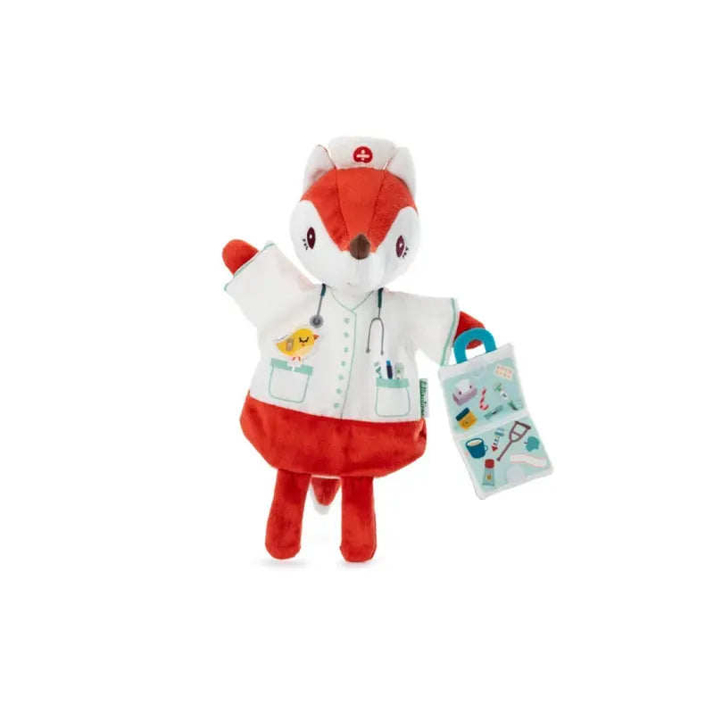 A Lilliputiens Alice Doctor Handpuppet, featuring a white uniform, nurse cap with a red cross, and a stethoscope around its neck. Perfect for imaginative play, the puppet holds a blue medical bag with various tools illustrated on it. Suitable for children 2 years+ to enjoy hours of fun.