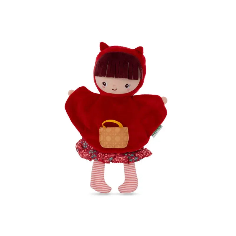 A plush Lilliputiens Red Riding Hood Handpuppet wearing a red hooded cape with small red ears, perfect for imaginative and creative play. The doll has a smiling face, short brown hair, and carries a small yellow-orange bag. It has a floral-patterned skirt and red and white striped leggings on a plain white background.