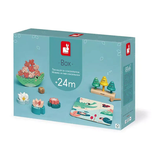 A well-organized blue Janod Box of Toys 24 Months. This delightful collection includes various wooden toys and puzzles for children aged 24 months and above, aimed at improving concentration. The box features images of the included developmental toys and a red Janod logo.