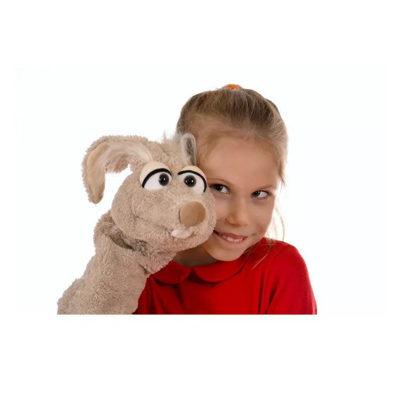 A little girl is performing a puppet show with the Living Puppets Manfred the Mouse Glove Puppet.