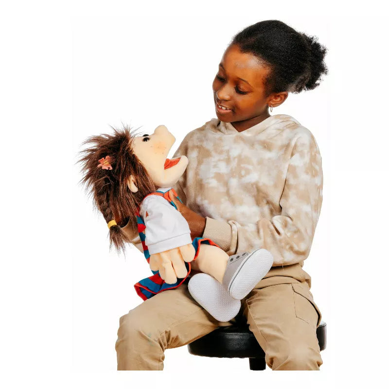 A young girl happily interacts with a Lischa Hand Puppet during a puppet show.
