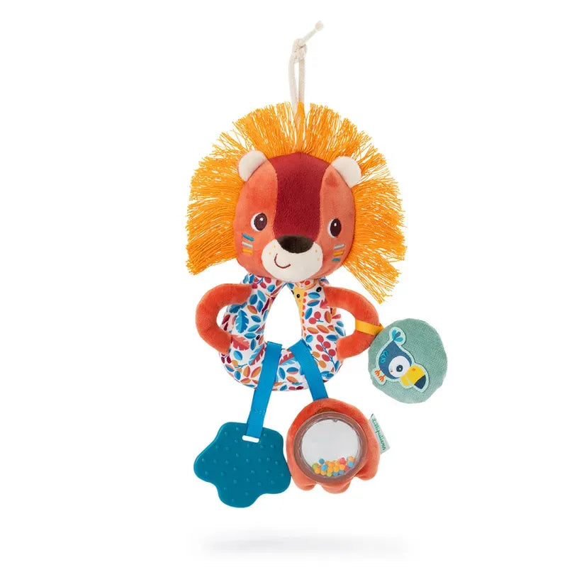 The Lilliputiens Jack Multi Activity Rings is a colorful plush lion toy featuring a red and orange mane, blue teether, and multi-colored ring with small beads to enhance baby's motor skills. The toy also includes a small fabric tag in the shape of a cat and doubles as a rattle, all hanging from a white string for easy attachment.