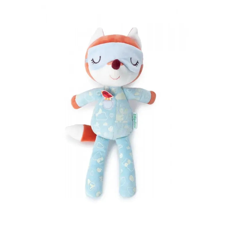 A plush fox toy wearing glow-in-the-dark pyjamas adorned with scattered white hearts and images of baby bottles. The Lilliputiens Alice Night Friend, similar to the other soft toy, has white and orange fur with a light blue sleep mask over its serene, sleeping expression. Its arms and legs are spread out comfortably.