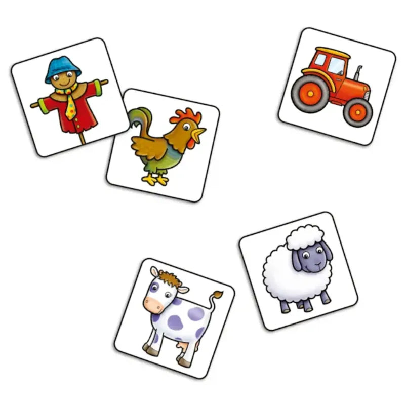 The Orchard Toys Old Macdonald Lotto set includes five illustrated cards, each showcasing a unique farm-themed image: a scarecrow, a rooster, a red tractor, a cow, and a fluffy sheep.