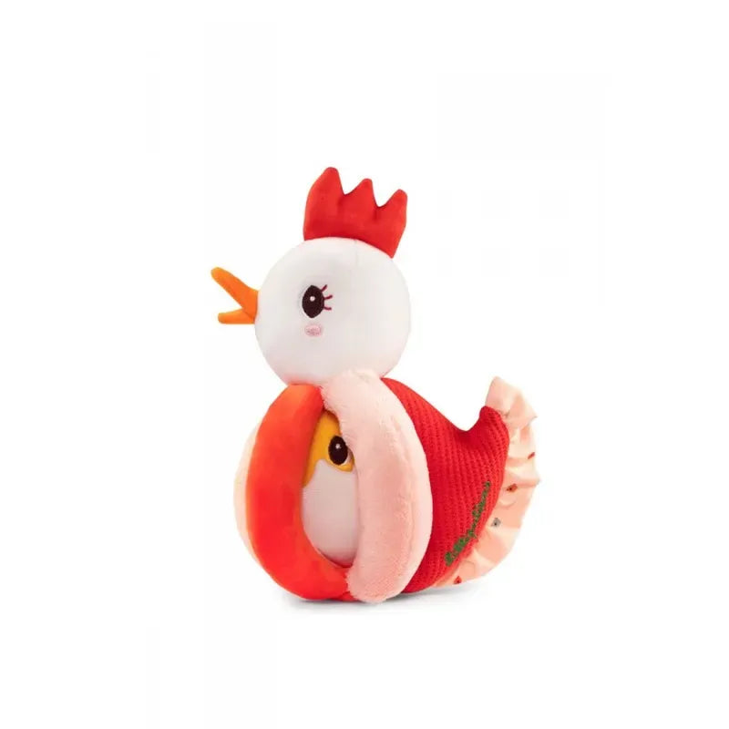 A Lilliputiens Paulette Rattle With Handles of a chicken with a white head, red comb, and beak, wearing a red and pink sweater-like outfit. The body seems to envelop a smaller, similar toy chick inside, with the chick's face peeking out from the opening. This sensory toy also doubles as a baby rattle for added fun and stimulation.